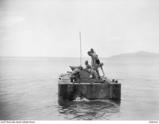 RABAUL, NEW BRITAIN. 1945-11-20. TYPE 2 AMPHIBIOUS JAPANESE TANK KA-MI IN THE WATER AT TALILI BAY. THE TRIALS ARE BEING CARRIED OUT BY MEMBERS OF 2/4 ARMOURED REGIMENT