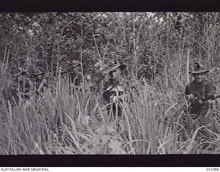 DONADABU, SOGERI VALLEY, NEW GUINEA. 1943-06-28. NX55545 PRIVATE (PTE) M. W. EGGELTON (FOREGROUND CENTRE); Q17072 PTE J. JOHNSTON (LEFT); Q16622 PTE J. M. RICHARDS (RIGHT), SECTION OF "A" COMPANY, ..