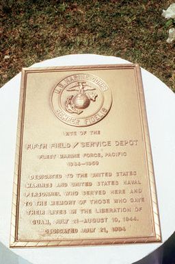 A plaque, placed on the site of the World War II Marine Fifty Field/Service Depot during the 50th anniversary ceremony of the Liberation of Guam, is dedicated to those who served and to the memory of those who gave their lives