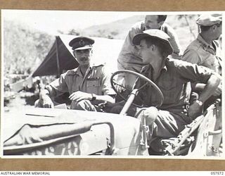 KAIAPIT, NEW GUINEA. 1943-09-25. VX9 MAJOR GENERAL G.A. VASEY CB OBE DSO, GENERAL OFFICER COMMANDING 7TH AUSTRALIAN DIVISION, LEAVING THE AIRSTRIP FOR BRIGADE HQ IN A JEEP