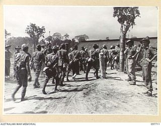 TOROKINA, BOUGAINVILLE. 1945-09-22. JAPANESE TROOPS FROM NAURU ISLAND, ON ARRIVAL AT TOROKINA PER SS RIVER BURDEKIN AND SS RIVER GLENELG, WERE MARCHED ALONG THE PIVA ROAD TO THE PRISON COMPOUND AT ..