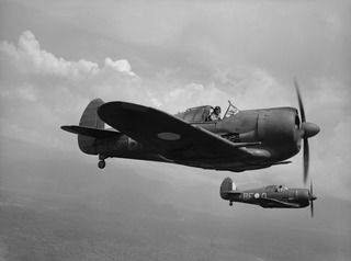 IN FLIGHT OVER BOUGAINVILLE ISLAND, SOLOMON ISLANDS. 1945-01-17. ACTING AS PATHFINDERS TO LOCATE AND MARK TARGETS, TWO AUSTRALIAN BUILT BOOMERANG AIRCRAFT OF NO. 5 (ARMY CO-OPERATION) SQUADRON RAAF ..