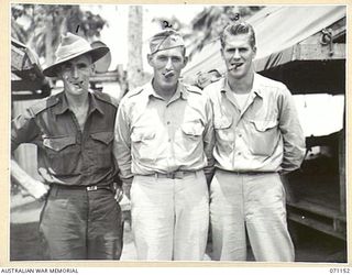 FINSCHHAFEN, NEW GUINEA, 1944-03-15. VX90176 SERGEANT R.J. BUCHANAN (1), PHOTOGRAPHER FROM THE MILITARY HISTORY AND INFORMATION SECTION, PICTURED WITH LIEUTENANT JOHN R. BOYSEN, OF SIOUX FALLS, ..