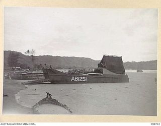 RABAUL, NEW BRITAIN. 1945-11-08. PUMICE STONE FROM THE MATUPI CRATER FLOATING ON THE WATER IN SIMPSON HARBOUR NEAR THE BP WHARF. IT IS A MENACE TO SMALL CRAFT MANY OF WHICH CANNOT OPERATE IN IT