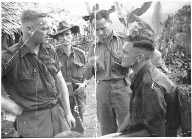 John Lewin [far left],  Lieutenant Colonel Patrick D. S. Starr with binoculars and Major George R. Warfe [right foreground] and others of the 2/3rd Australian Independent Company, New Guinea, July, 1943