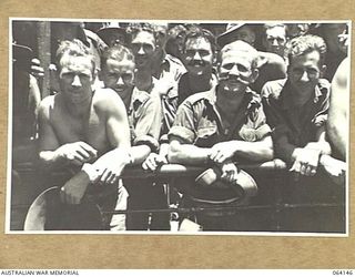 TOWNSVILLE, QUEENSLAND, AUSTRALIA. 1944-01-28. PERSONNEL OF THE 24TH INFANTRY BRIGADE ABOARD THE TROOPSHIP "VAN HEUTSZ" IMPATIENTLY WAITING TO LAND IN AUSTRALIA AFTER A LONG TOUR OF DUTY IN NEW ..