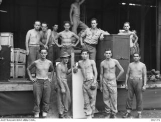 JACQUINOT BAY, NEW BRITAIN. 1945-05-18. PERSONNEL OF 2ND DIVISION CONCERT PARTY CLEANING UP THE STAGE AND PACKING THEIR GEAR AFTER A CONCERT AT HEADQUARTERS 5TH DIVISION. LEFT TO RIGHT: BACK ROW: ..
