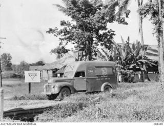 LAE AREA, NEW GUINEA. 1944-12-20. A YMCA AUSTRALIAN COMFORTS FUND TRUCK CARRYING TEA TO 4 ADVANCED ORDNANCE DEPOT. THE DRIVER CORPORAL W R WATSON WAS ACCOMPANIED BY HIS ASSISTANT PRIVATE W H CRANE