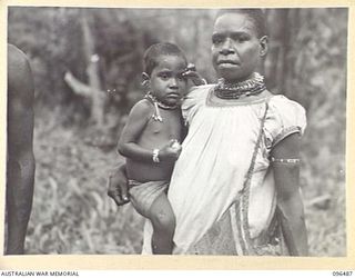 RABAUL, NEW BRITAIN, 1945-09-12. NATIVE MOTHER AND CHILD OF THE RABAUL AREA PHOTOGRAPHED IN THE EARLY STAGES OF THE OCCUPATION BY AN AUSTRALIAN FORCE DRAWN FROM 4 INFANTRY BRIGADE AFTER THE ..