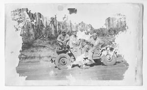 [Three Servicemen on Jeep in Bougainville]