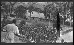 Missionary giving hookworm lecture to Vella Lavella Islanders