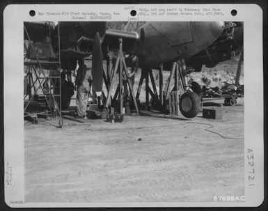 A Lockheed P-38 "Lightning" Is Repaired By Men Of The 27Th Air Depot Group At The Port Moresby Air Depot, Papua, New Guinea. 7 October 1943. (U.S. Air Force Number 67699AC)