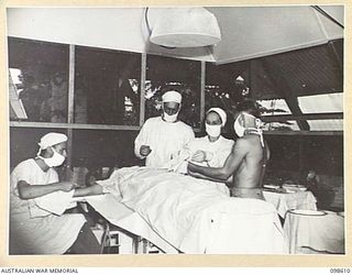 RABAUL, NEW BRITAIN. 1945-11-02. THE NEW OPERATING THEATRE AT 105 CASUALTY CLEARING STATION, SHOWING A MAJOR OPERATION IN PROGRESS