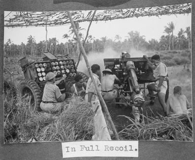 Members of the Tonga Defence Force of 2nd NZEF, firing a large gun in Tonga