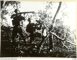 1942-12-28. THIS PHOTO WAS TAKEN DURING THE FIGHTING. THE TANKS CRASHED THROUGH A JAPANESE CHAIN OF HEAVILY FORTIFIED PILLBOXES. (NEGATIVE BY G. SILK)