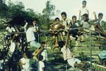 Christmas party at the Social Club House by a women's club, children at play on old frames from army trucks), Port Moresby, 1962