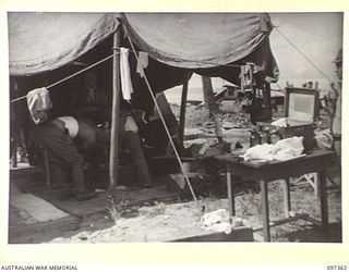 BUIN AREA, BOUGAINVILLE. 1945-09-28. A JAPANESE REGIMENTAL AID POST SET UP ON THE BEACH NEAR KANGU HILL, THE EMBARKATION POINT FOR JAPANESE NAVAL TROOPS IN THE BUIN AREA. THE SURRENDER PARTY FROM ..