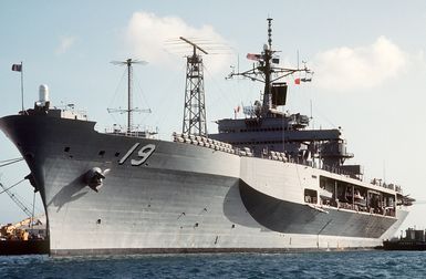 A port bow view of the amphibious command ship USS BLUE RIDGE (LCC-19) docked during a port visit