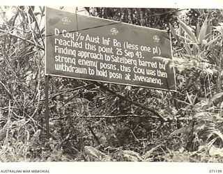 FINSCHHAFEN AREA, NEW GUINEA, 1944-03-17. ONE OF MANY BATTLE SIGNS IN THE AREA, THIS SIGN RECORDS ACTIVITIES OF THE 2/17TH INFANTRY BATTALION IN THE BATTLE FOR SATTELBERG