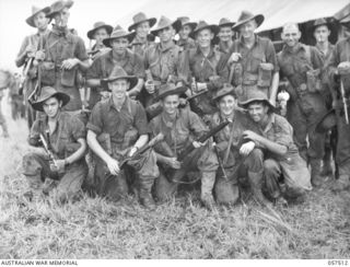 KAIAPIT, NEW GUINEA, 1943-09-22. MEMBERS OF NO. 8 SECTION, C PLATOON, 2/6TH AUSTRALIAN INDEPENDENT COMPANY, PRIOR TO MOVING OUT ON PATROL AFTER THEIR CAPTURE OF THE MISSION