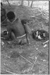Fainjur: man and woman prepare food, infant watches