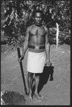 Man posing with old police belt and afui, also alafolo, club