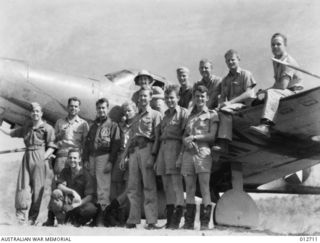 PORT MORESBY. A GROUP OF PILOTS OF THE UNITED STATES ARMY AIR CORP AIRACOBRA 40TH PURSUIT SQUADRON. (NEGATIVE BY D. PARER.)