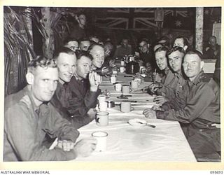 TOKO, BOUGAINVILLE. 1945-08-28. STAFF OFFICERS OF HEADQUARTERS 3 DIVISION AT THE DINNER HELD TO CELEBRATE VICTORY OVER JAPAN. THE DINNER WAS ATTENDED BY MAJOR GENERAL W. BRIDGEFORD, GENERAL OFFICER ..
