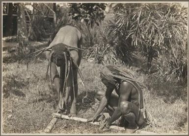 Mount Lamington types, fire making / Frank Hurley