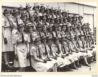Group portrait of the members of the Women's Land Army at the Atherton Barracks. There are over 50 women at the barracks who work a 5 day week within a 12 mile radius of Atherton. Identified, left ..