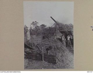 HAWAIN, WEWAK AREA, NEW GUINEA. 1945-05-09. A "LONG TOM" 155MM GUN, MANNED BY A 2/3 FIELD REGIMENT GUN CREW, FIRING ITS 95-LB PROJECTILE WHILE SUPPORTING THE ATTACK AGAINST THE MAIN JAPANESE ..
