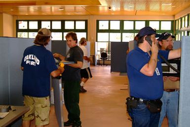 [Earthquake] Honolulu, HI, October 28, 2006 - FEMA MERS communication specialists establish KU bands for the joint field office and Redding, CA smokejumpers build partisians for FEMA divisions. Adam DuBrowa/FEMA.