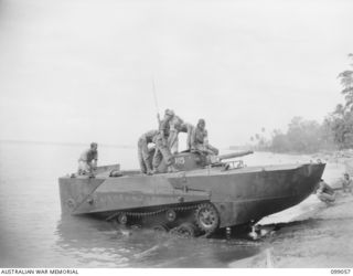 RABAUL, NEW BRITAIN. 1945-11-20. A JAPANESE TYPE 2 KA-MI AMPHIBIOUS TANK COMING ASHORE AFTER TRIALS CARRIED OUT BY MEMBERS OF 2/4 ARMOURED REGIMENT IN TALILI BAY
