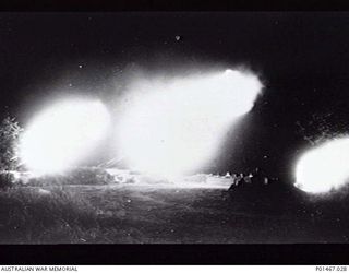 ORO BAY, NEW GUINEA. 1943. MEMBERS OF 5TH HEAVY ANTI-AIRCRAFT BATTERY, 2/2ND ANTI-AIRCRAFT REGIMENT, PARTICIPATING IN NIGHT OPERATIONS. (DONOR RSL NATIONAL HEADQUARTERS)