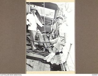 OFF PORT MORESBY, PAPUA. 1942-08-30. THE CAPTAIN, CAPTAIN R. DUDDELL, (RIGHT) AND THE CHIEF OFFICER, MR. W.D. COLQUHON MALAITA WHICH HAD THE PREVIOUS DAY BEEN TORPEDOED BY AN ENEMY SUBMARINE OFF ..