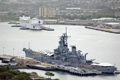 The U.S. Navy Military Sealift Command Hospital Ship, the USNS MERCY (T-AH 19) enters Pearl Harbor, HI., for a brief port visit before returning to her San Diego, Calif., homeport. The USNS MERCY (T-AH 19) which operated off the coast of Dili, East Timor provided humanitarian assistance to local residents. Sept. 20, 2006. (U.S. Navy photo by CHIEF Mass Communication SPECIALIST 1ST Class Dennis Cantrell) (Released)