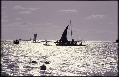 Silhouette of boat with triangle sail