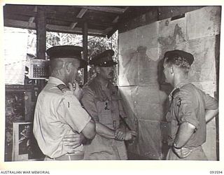 JACQUINOT BAY, NEW BRITAIN, 1945-07-01. HIS ROYAL HIGHNESS, THE DUKE OF GLOUCESTER, GOVERNOR-GENERAL OF AUSTRALIA (2), SPEAKING WITH WING COMMANDER P.A. MATHESON, ROYAL NEW ZEALAND AIR FORCE ..