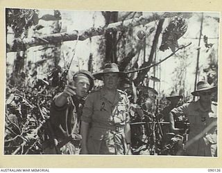 COMPTON RIVER AREA, BOUGAINVILLE. 1945-03-31. LORD WAKEHURST, GOVERNOR OF NEW SOUTH WALES (2), WITH PRIVATE A. BAMBACK, 26 INFANTRY BATTALION (1), DURING HIS VISIT WITH LADY WAKEHURST AND LADY ..