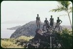 Men posing on top of a pile