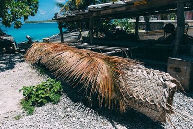 Boatshed with covered canoe, Atafu, Tokelau