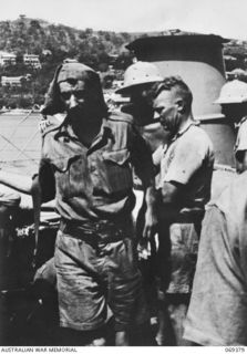 PORT MORESBY, NEW GUINEA. 1942-04-12. ONE OF THE EVACUEES FROM NEW BRITAIN LEAVING THE HMAS "LAURABADA". HE AND OTHER EVACUEES TOOK TO THE JUNGLE FOLLOWING THE SUCCESSFUL JAPANESE LANDING AT RABAUL ..