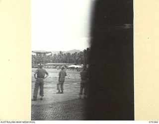 MILNE BAY, NEW GUINEA. 1944-02-09. THE FIRST MOSQUITO MEDIUM BOMBER IN THE NEW GUINEA AREA ARRIVING AT GURNEY AIRSTRIP AFTER A TEST FLIGHT FROM TOCUMWAL, NEW SOUTH WALES. THE AIRCRAFT HAS FLATTENED ..