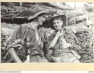 1943-08-09. NEW GUINEA. AS THE BATTLE FOR MOUNT TAMBU NEAR SALAMAUA GOES ON AUSTRALIAN VETERANS REALISE THEY HAVE NEVER FOUGHT A NASTIER COMBINATION THAN THE JUNGLE AND THE JAPANESE. HERE ARE PTE. ..