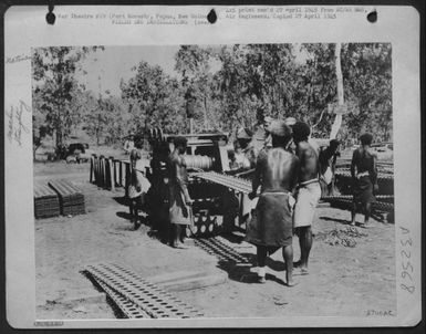 Landing Mat Straightening Machine At Port Moresby, Papua; New Guinea. (U.S. Air Force Number 57111AC)