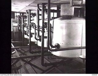 DONADABU AREA, NEW GUINEA. 1943-11-08. HUGE FILTER TANKS IN THE LALOKI RIVER PUMPING STATION WHICH IS SITUATED ABOUT A MILE UPSTREAM FROM THE BOMANA PUMPING STATION AND SUPPLIES 300,000 GALLONS PER ..