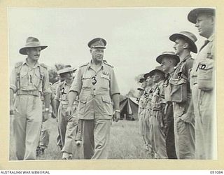 LAE AREA, NEW GUINEA. 1945-04-25. MAJOR-GENERAL C. H. SIMPSON, SIGNAL OFFICER-IN-CHIEF (3), ACCOMPANIED BY CAPTAIN K. R. H. BALLANTYNE, COMPANY COMMANDER, HEADQUARTERS COMPANY, 19 LINES OF ..