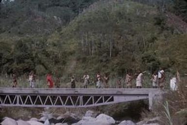 [People standing on a bridge in Papua New Guinea]