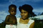 Woman holding a child, Lae