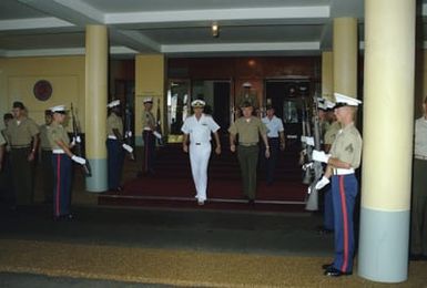 (LGEN) D'Wayne Gray, commanding general, Fleet Marine Force Pacific, right, and Admiral (ADM) William J. Crowe Jr., commander in chief, US Pacific Command, attend morning colors